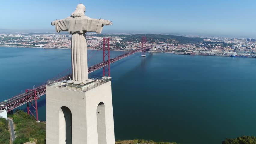 Aerial bird view of Sanctuary of Christ the King in Portuguese Santuario de Cristo Rei Catholic monument and shrine dedicated to Sacred Heart of Jesus Christ overlooking city of Lisbon Portugal 4k Royalty-Free Stock Footage #31652065