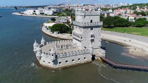 Aerial of Belem Tower Lisbon moving backwards in Portuguese Torre de Belem or Tower of St. Vincent is fortified tower located in civil parish of Santa Maria de Belem in municipality of Lisbon Portugal