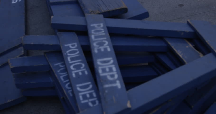 Wooden Police department barricades on ground