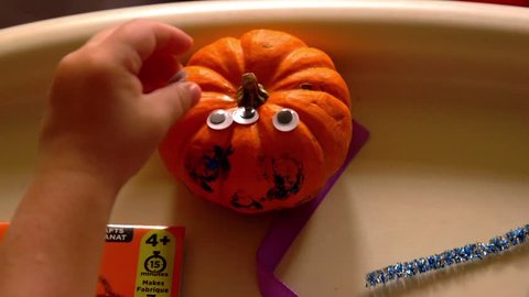 Video Of A Young Toddler Boy Making Spooky Halloween Crafts With His Mom At Their Living Room Table
