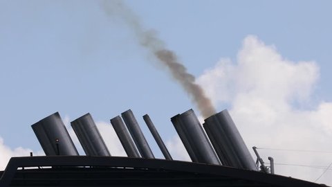 Exhaust smoke of a huge ocean giong ship
