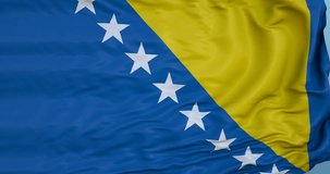Seamlessly Looping flag for Bosnia Herzegovina, blowing beautifully in the wind. Slo-Motion. Available in 4K.