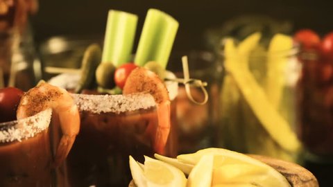 Bloody mary cocktail bar with variety of garnishes.