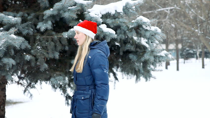 girl  walks in winter wood 