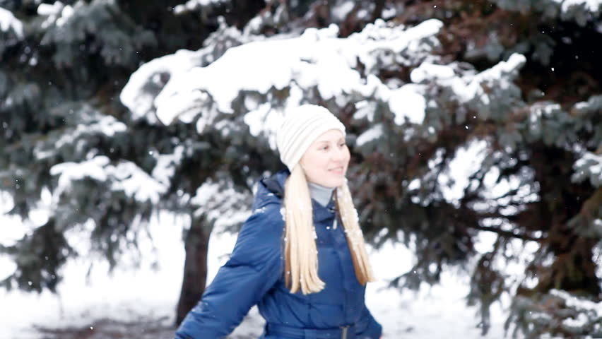 girl walks in winter wood 