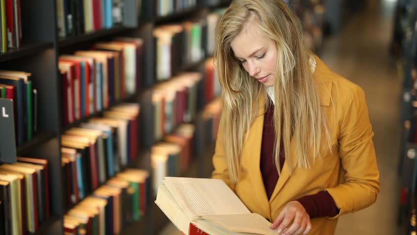 Woman Reading Book in Library, Stock Footage Video (100% Royalty-free)  31674082 | Shutterstock