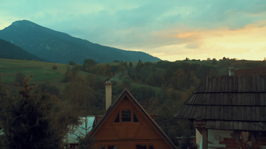 Village House in the mountains on the sunset time. 4K.
