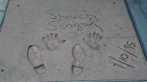 HOLLYWOOD, CA - CIRCA 2011: Steven Seagal's hand and footprints at Grauman's Chinese Theater on Hollywood Boulevard in Hollywood, California.