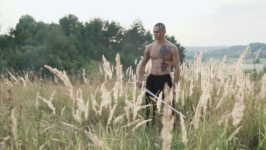 Modern cossack workouts with swords in the fields 4K