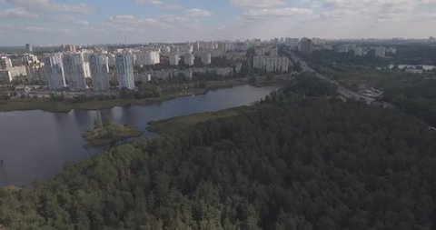 aerial survey: Kiev-Akademgorodok. cityscape from the air. Forest landscape with a view of the lake and metropolis. a beautiful lake on the edge of the city. green forest with a lake urban landscape.
