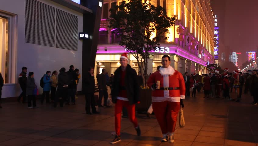 shanghia,China - Dec 15:peoples dressed in christmas clothes,walking through
