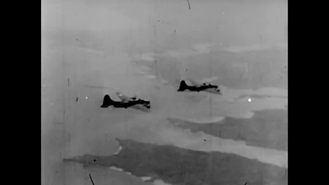 CIRCA 1943 - Boeing B-17 Flying Fortresses drop bombs on harbor installations in Wilhelmshaven, Germany and aerial combat ensues during World War 2.