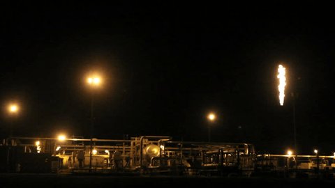Oil well platform illuminated at night. In the  Ecuadorian Amazon.