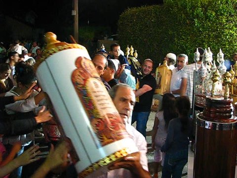 TIVON, ISRAEL – CIRCA 2008: Men dance with Bible scrolls during the ceremony of Hakafot Suchot Simchas Torah, lit. 'Rejoicing with/of the Torah' Tivon, Israel Circa 2008