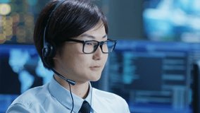 In the Customer Support Center Representative Makes Calls and Talks with Customer Through the Headset. 4K UHD. - Powered by Shutterstock - Get 15% off with code: PIKWIZARD15