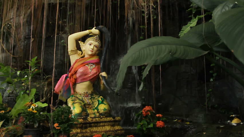 Sculpture in bushes. Golden mount (Wat Saket) Bangkok Thailand.