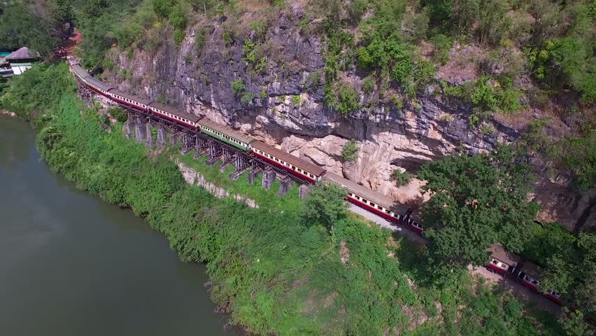 Aerial View at Beautiful landscape Death Railway bridge over the Kwai Noi River at Krasae cave in Kanchanaburi province Thailand Royalty-Free Stock Footage #31700110