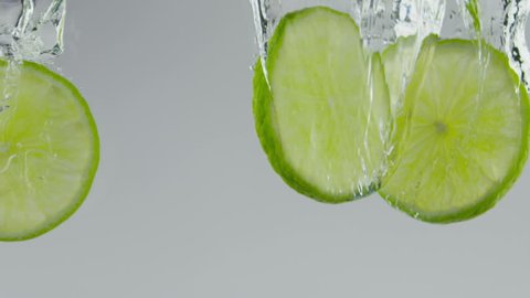 limes dropped in water