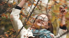 Young beautiful woman in an autumn park