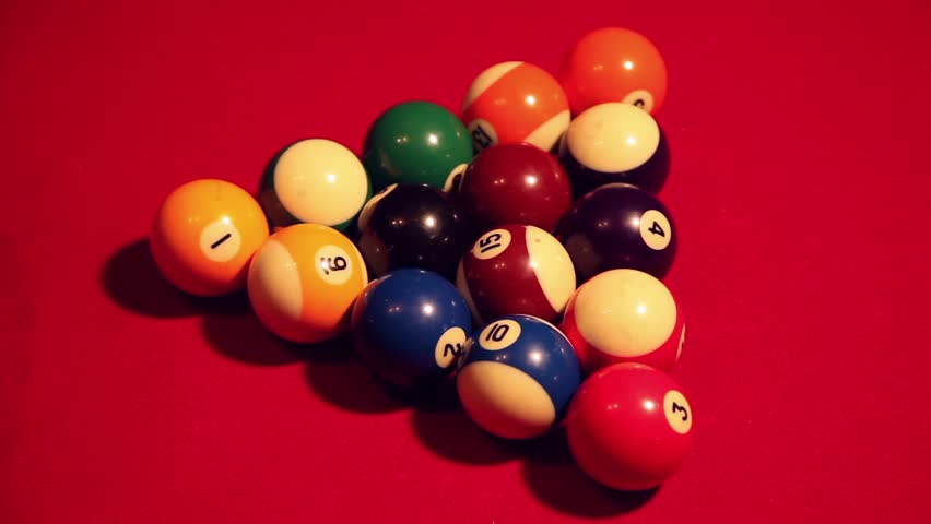 Closeup shot of a triangle of billiard balls being broken and the game starting. | Shutterstock HD Video #31709278