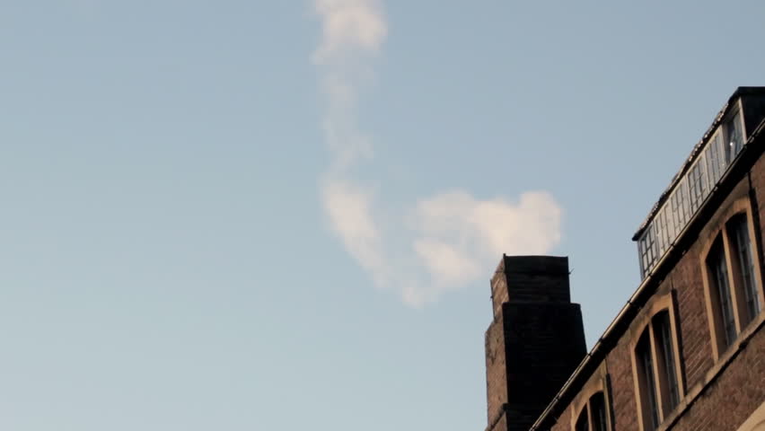 Smoking chimney of old industrial building