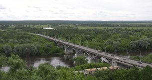 4K high quality video footage view of outskirts of town with highway bridge, road, churches in distance near medieval town Vladimir on Golden Ring route some 200 km from Moscow, Russia on summer day