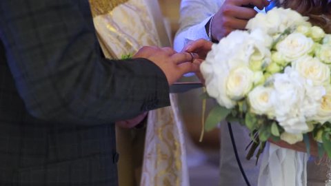 The couple wear rings. An oath of love .Wedding rings.
