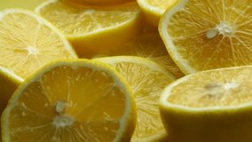 Lemon slices with mint leaf rotation background. Close-up of a delicious ripe lemon rotate and aromatic mint. Healthy food, cooking ingredient. UHD video footage. Ultra high definition 3840X2160