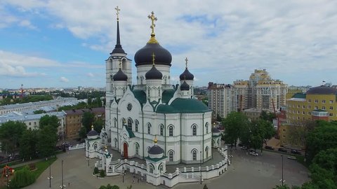Pervomaysky park near cathedral of Annunciation and Voronezh cityscape at summer day. Aerial view. Cathedral was destroyed after revolution and reconstruction started in 1998.