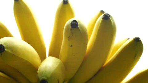Bananas. A bunch of bananas rotates, an interesting foreshortening, an advertising shot. 스톡 비디오