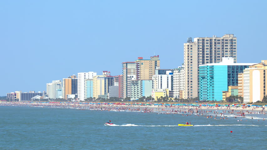 Summertime South Carolina Coastal Scene at Myrtle Beach SC with Thousands of Vacationing Visitors Enjoying the Beachfront Resort Hotels and Atlantic Ocean on a Sunny Day