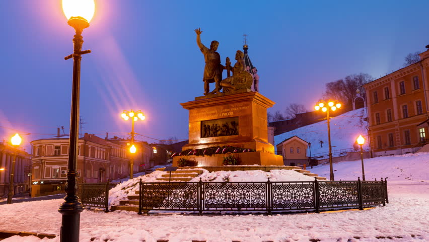 Nizhny Novgorod, Russia. Hyperlapse of Minin and Pozharsky monument near Kremlin at night in Nizhny Novgorod, Russia. Lighted street lamps and snow. Dark sky, time-lapse at night