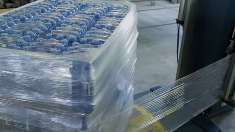 Packages with bottled water are packed in polyethylene automatically. On special equipment finished products are covered with soft material for safe delivery.