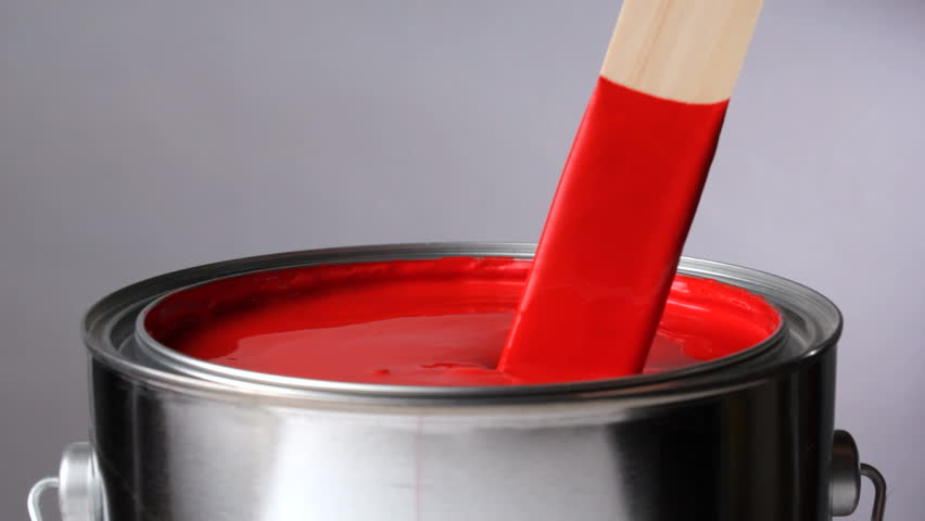 Stirring red paint
