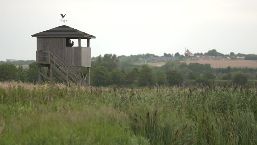 birdwatchers in the lookout tower teleshot