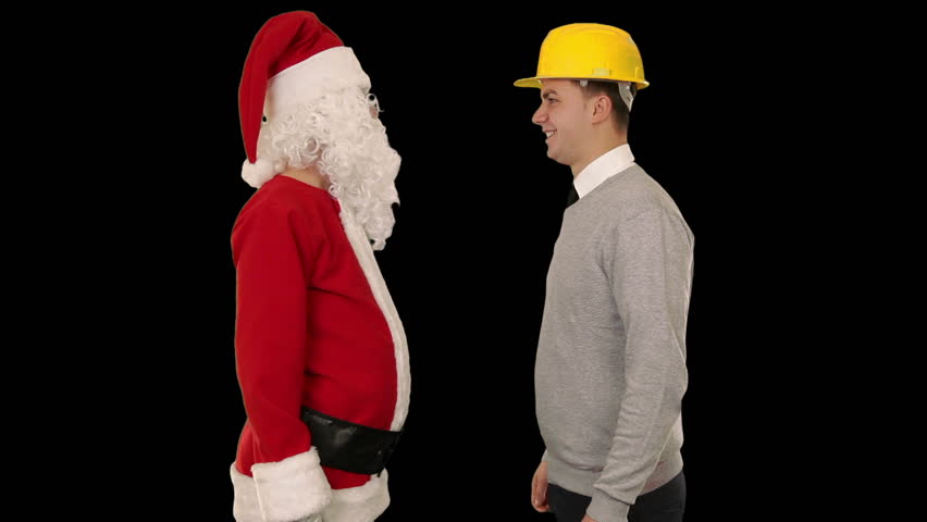 Santa Claus and Young Architect against black, shaking hands and looking at