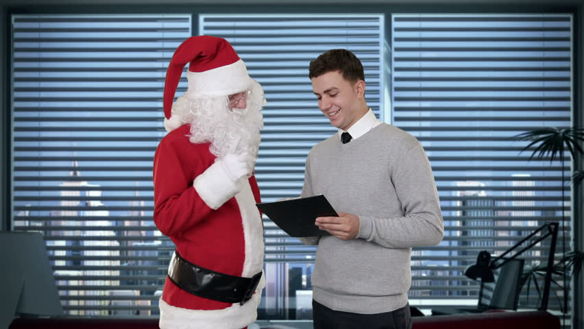 Santa Claus and Young Businessman in a modern office