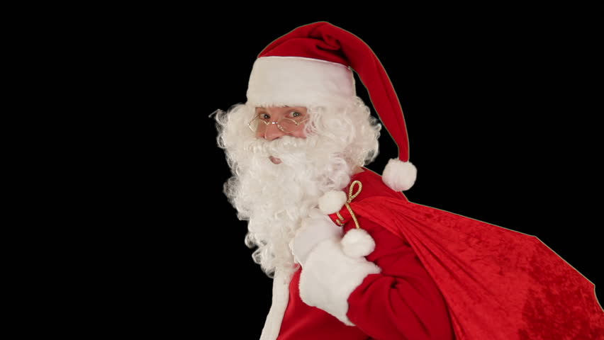 Santa Claus carrying his bag, looks at the camera and winks, black