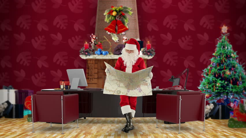 Santa Claus reading a map in his modern Christmas Office