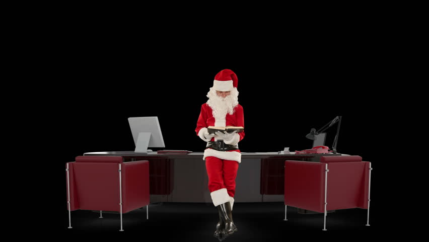 Santa Claus reading a book in his modern Christmas Office, against black