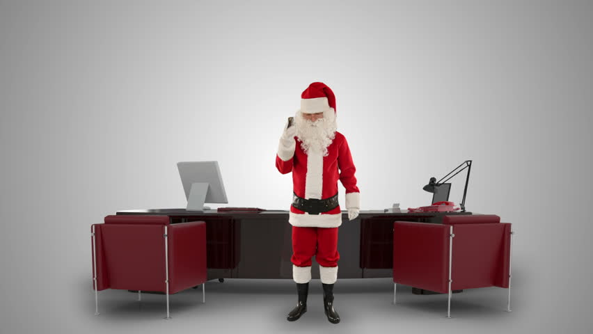 Santa Claus talking on mobile in his modern Christmas Office, against white