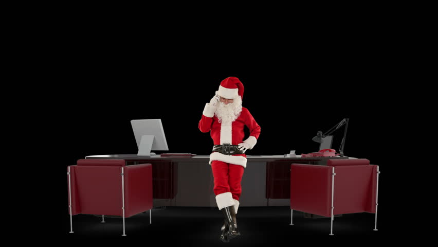 Santa Claus on mobile in his modern Christmas Office, against black