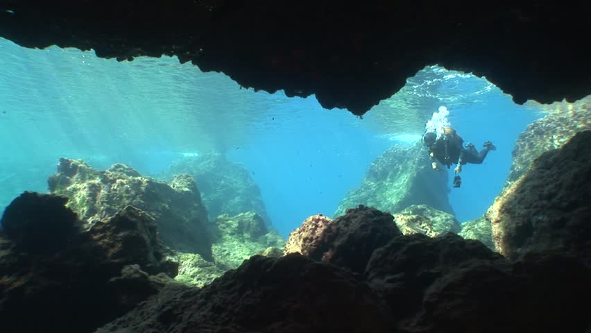 cave diving underwater scuba divers exploring cave dive  Royalty-Free Stock Footage #31778227