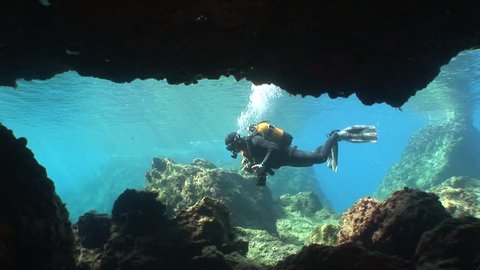 cave diving underwater scuba divers exploring cave dive 