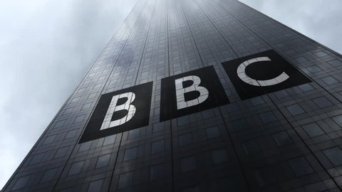 British Broadcasting Corporation BBC logo on a skyscraper facade reflecting clouds, time lapse. Editorial 3D rendering