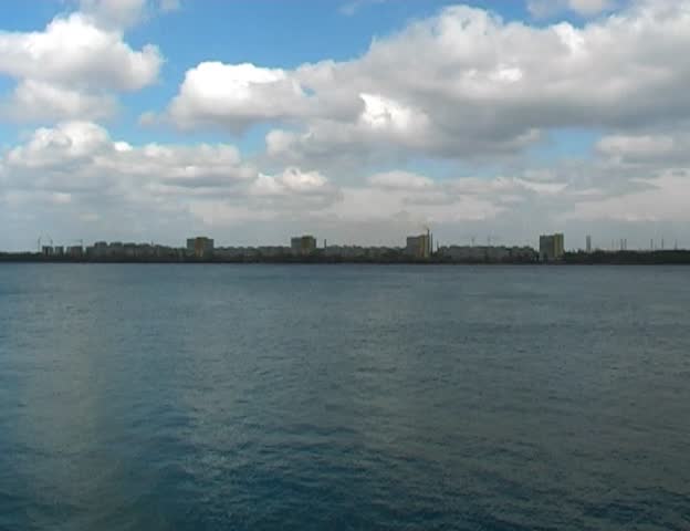 clouds under wide river