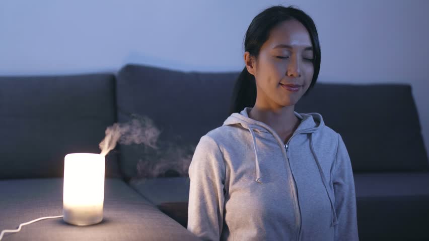 Woman sitting at home and meditating  Royalty-Free Stock Footage #31788112