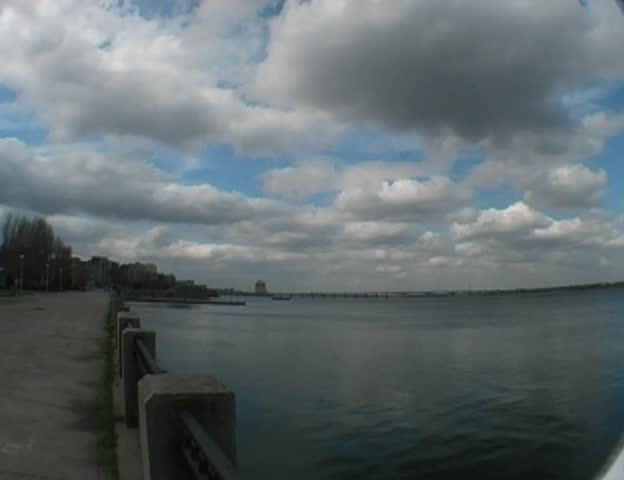 clouds under wide river
