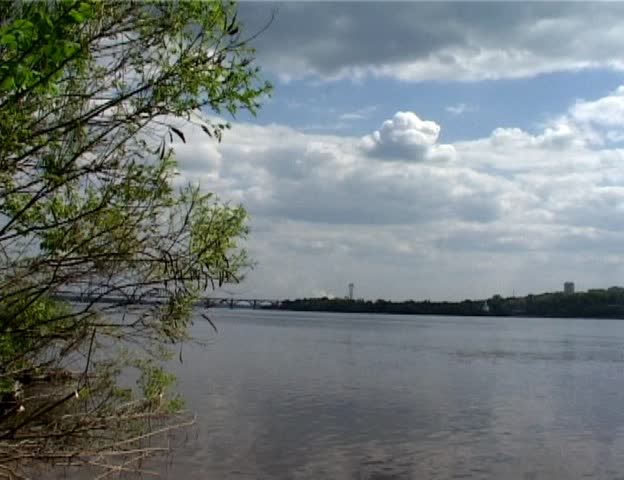 clouds under wide river