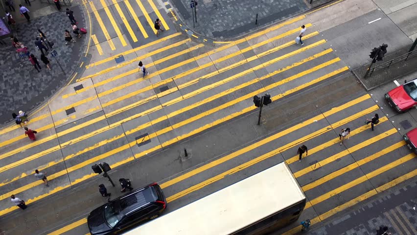 Time lapse video of the pedestrian crossing in Kong Kong. It is a top view from Chungking Mansions famous with its budget accommodation Royalty-Free Stock Footage #31796518